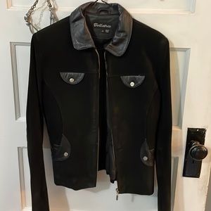 Black suede jacket with leather collar, patch pocket detail. Zip front